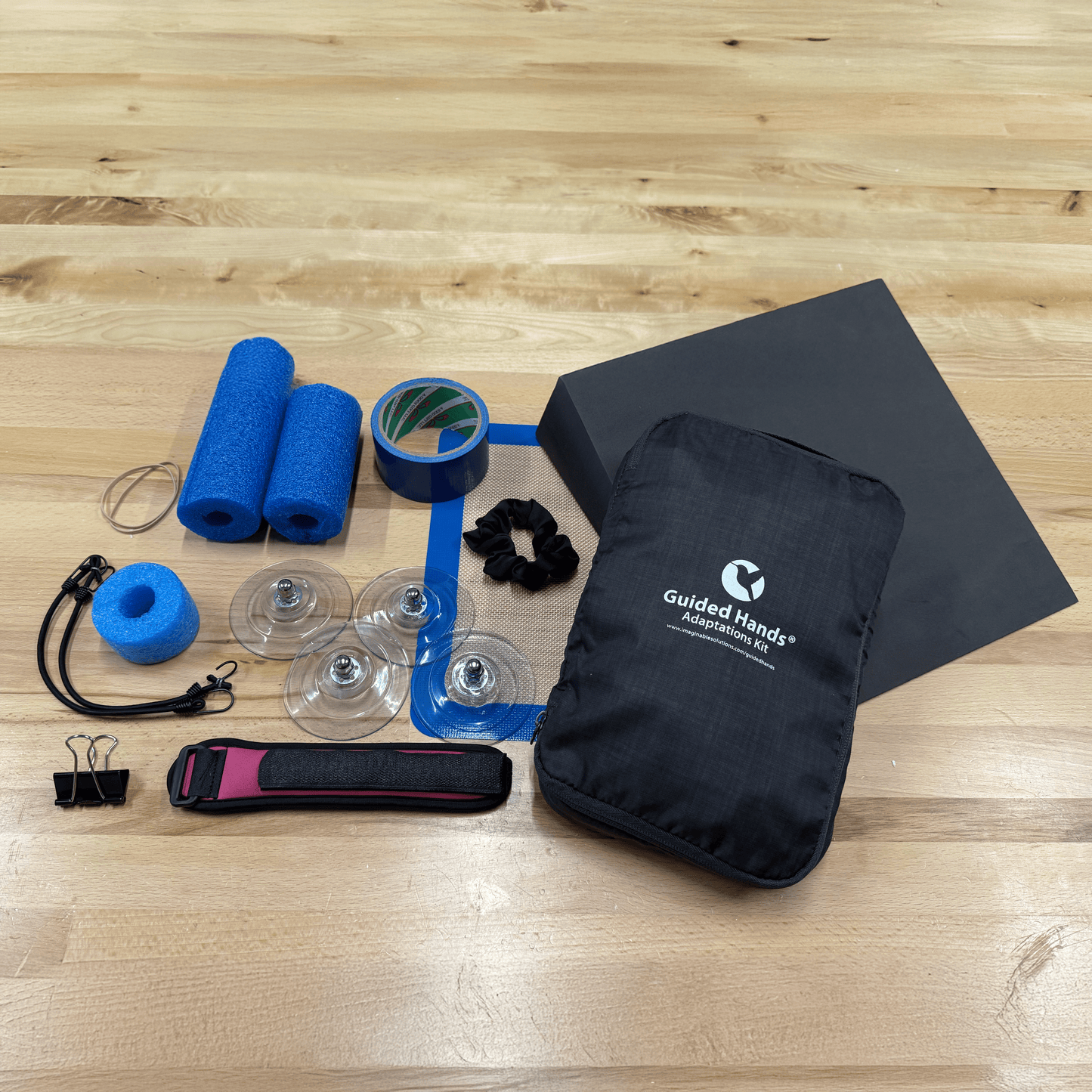 Full display of what comes in the Guided Hands Adaptations Kit