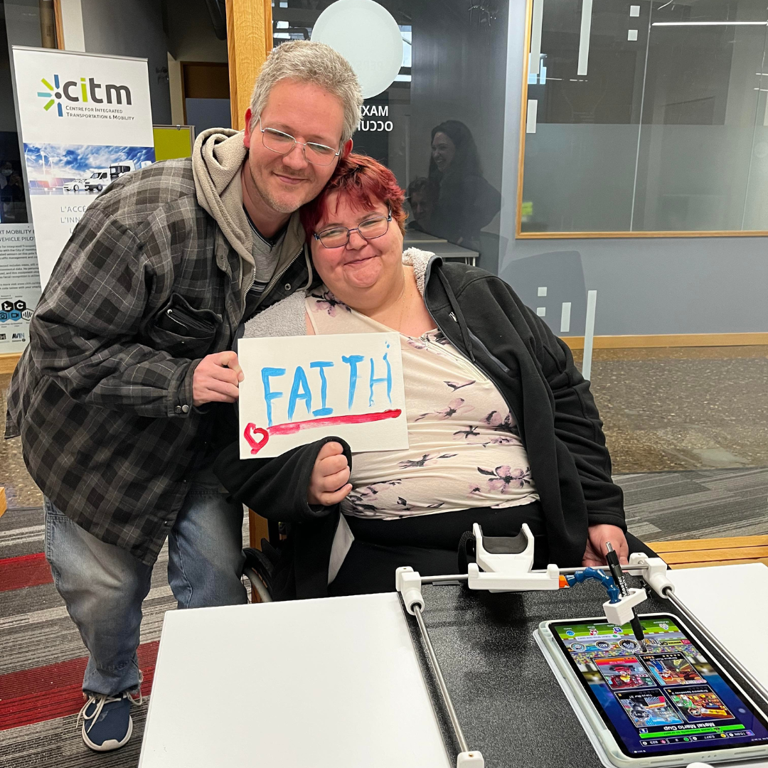 Couple showing off artwork that was created with Guided Hands